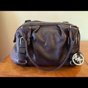 Plum Michael Kors purse with silver accents